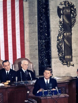 John F. Kennedy delivering a State of the Union address, with fasces immediately behind him.