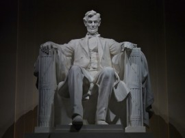 Abraham Lincoln by Daniel Chester French: Lincoln's hands rest on two large fasces.